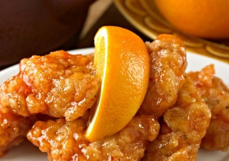 Delicious Air Fryer Orange Chicken served with a side of vegetables