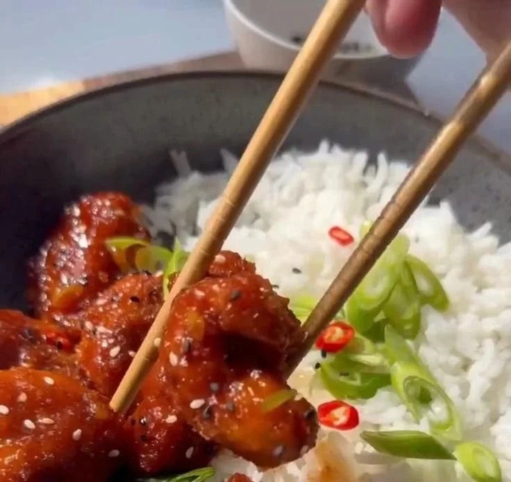 Crispy Air Fryer Sesame Chicken served with sesame seeds and green onions